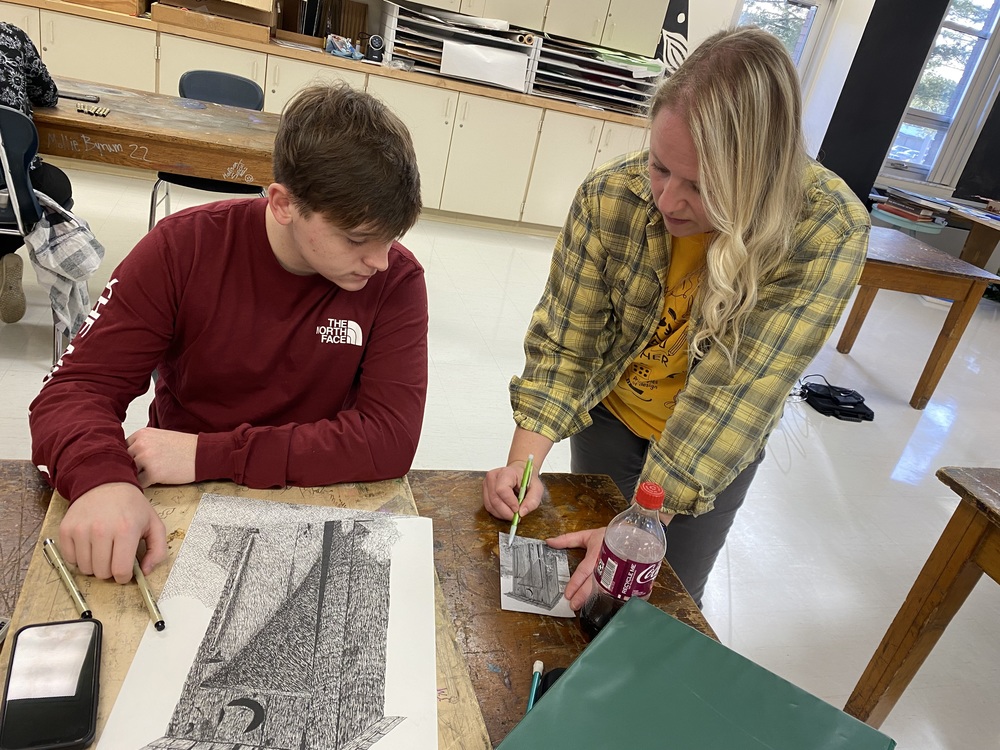 SHS art teacher Carole Clodfelter with a student