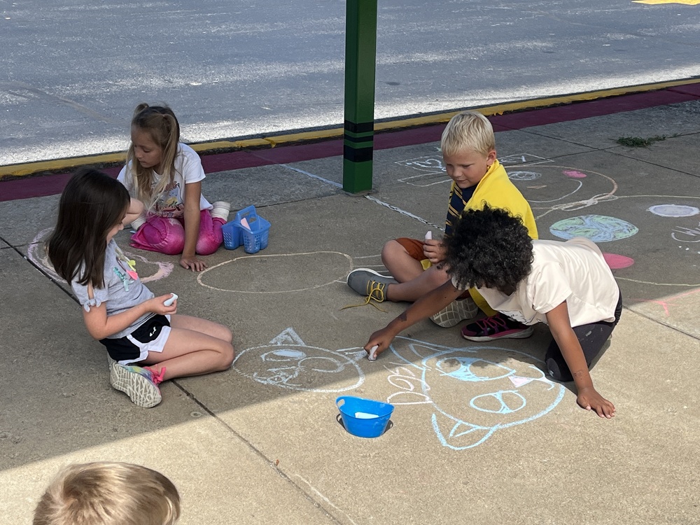 BSE students creating with chalk