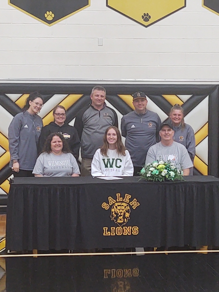 Bailey with her parents and coaching staff