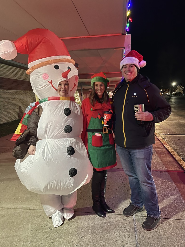 Assistant Principal Nicole Colwell dressed as an inflatable snowman,  Principal Kelly Williams  dressed as an elf, and Assistant Principal Clinton Blankenbaker with a santa hat on. 